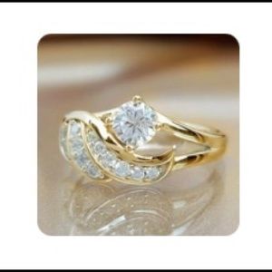 Golden colour size 7 ring with a clear stone